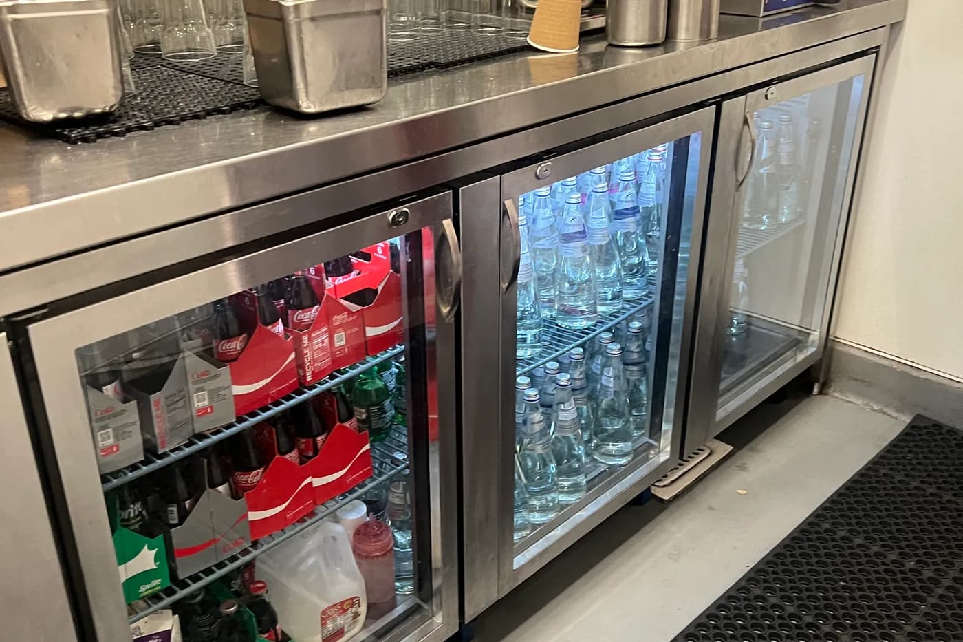 Bar back-bar cooler and draft beer kegerator system in a commercial restaurant bar setting