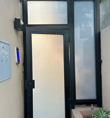 Coastline Gate Repair technician servicing a commercial automatic gate at a Southern California restaurant