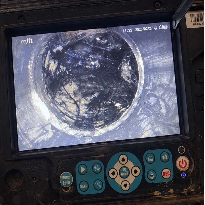 Drain camera view of a grease waste line blocked with fats, oils and grease