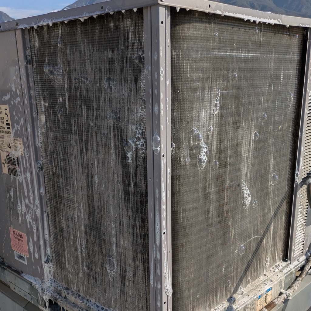 Rooftop kitchen HVAC condenser coil clogged with grease and grit